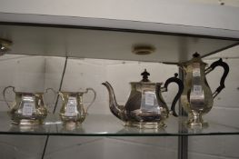 A plated four piece tea service.
