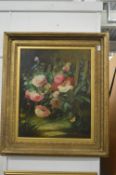 W Larsen, a still life of flowers and plants by a fence, oil on board, signed.