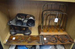 A brass and oak magazine rack, two book rests, kitchen scales and trophy cups.