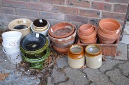 Various terracotta and other plant pots.