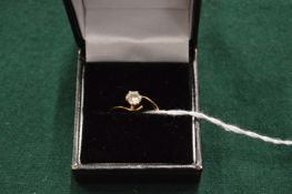 An 18ct gold and diamond solitaire ring.