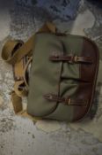 A leather and canvas holdall.
