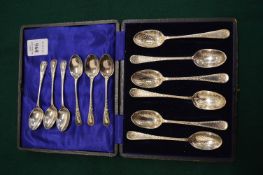 A cased set of six silver coffee spoons with engraved and bright cut decoration together with a