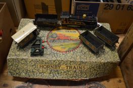 A Hornby O gauge clockwork train set and track.