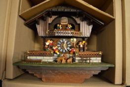 A cuckoo clock, boxed, appears unused.