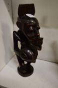 An African carved wood figure.