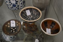 Three small Chinese pottery bowls.