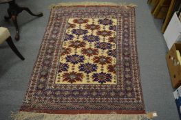 A Persian design rug, cream ground with stylised decoration (moth damage) 162cm x 115cm.