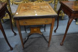 A Victorian inlaid rosewood envelope card table.