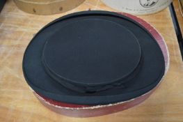 A Lock & Co collapsible theatre hat with original box, internal size 20cm x 16.5cm.