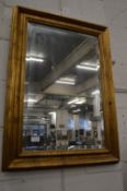 Gilt framed rectangular wall mirror.