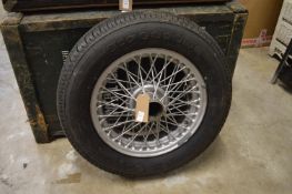 A spoked wheel from an Austin-Healey motor car, complete with Firestone tyre.