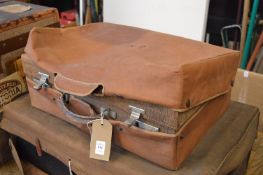 A vanity case with outer canvas cover.