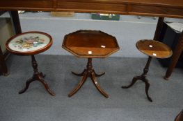 Three mahogany occasional tables.
