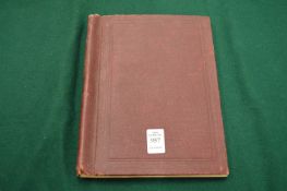 A small stamp album and contents.