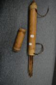 A bamboo quiver containing arrows.