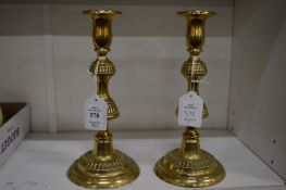 A pair of brass candlesticks.