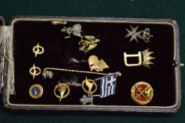 A collection of pin badges, tie pin etc.