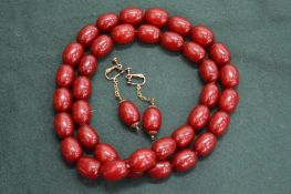 A bead necklace and pair of matching earrings.