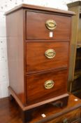 A pair of mahogany three drawer pedestal chests.