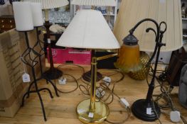 Various table lamps and candle stands.