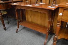 A Victorian walnut two-tier rectangular table.