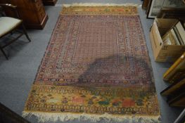 Persian design rug with all over geometric design (stained) 200cm x 137cm.
