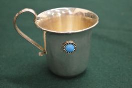 A Continental silver cup with cabochon stone mount.