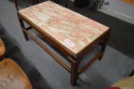A mahogany framed and marble topped rectangular coffee table.