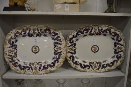 A pair of Chamberlains Worcester serving dishes with gilt and blue decorated borders, having baskets