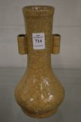 Chinese crackle glaze vase with pair of tube shaped handles.