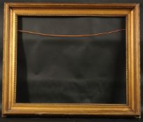 A GILTWOOD SPOON PICTURE FRAME. Rebate size 18ins x 22ins.