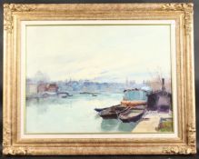 GUSTAVE MADELAINE (1867-1944) FRENCH. River scene with boats and buildings. Signed. Oil on canvas.