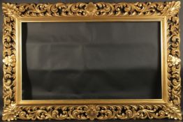 A GOOD CARVED FLORENTINE GILTWOOD PICTURE FRAME. Rebate size 24inx x 42ins.