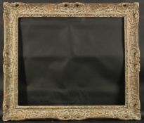 A FRENCH CARVED WOOD PICTURE FRAME. Rebate size 21ins x 25ins.