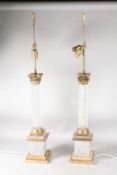 A VERY GOOD PAIR OF CUT GLASS AND ORMOLU CORINTHIAN COLUMN LAMPS, each for two lights. 3ft 6ins