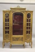 A LARGE GILTWOOD BREAKFRONT STANDING CUPBOARD with large central glass panel door, doors to the