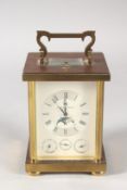 A MATTHEW NORMAN FOUR DIAL BRASS CARRIAGE CLOCK, dated 1981. 5ins high, in a folding leather case.