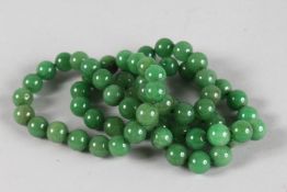 A STRING OF LARGE JADE BEADS. 3ft long.