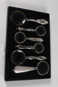 A SET OF SIX VARIOUS MAGNIFYING GLASSES in a case.