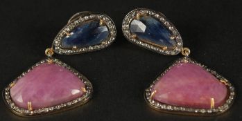 A PAIR OF UNUSUAL DROP EARRINGS set with large, mixed rose-cut sapphires and rubies with a diamond