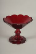 A CUT GLASS RUBY TINTED TAZZA. 18cms diameter.