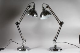 A LARGE PAIR OF ANGLE POISE LAMPS.