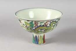 A CHINESE WUCAI PORCELAIN DRAGON STEM CUP. 17cms diameter.