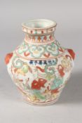 A CHINESE WUCAI PORCELAIN VASE. 15.5cms high.