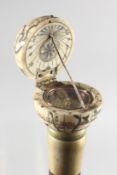 A WALKING STICK with carved bone globe.