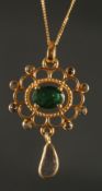 A FANCY PENDANT in yellow metal set with oval emerald, rose-cut diamonds and a suspended slice