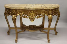 A LOUIS XVITH GILDED MARBLE TOP CONSOLE AND MIRROR, the shaped base with marble top, scrolls and