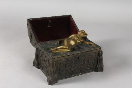 A GOOD 19TH CENTURY CAST BRONZE NOVELTY CASKET, the domed lid opens to reveal a nude young lady