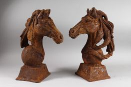 A PAIR OF CAST IRON HORSE'S HEADS. 17ins high.